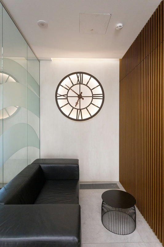 black round analog wall clock