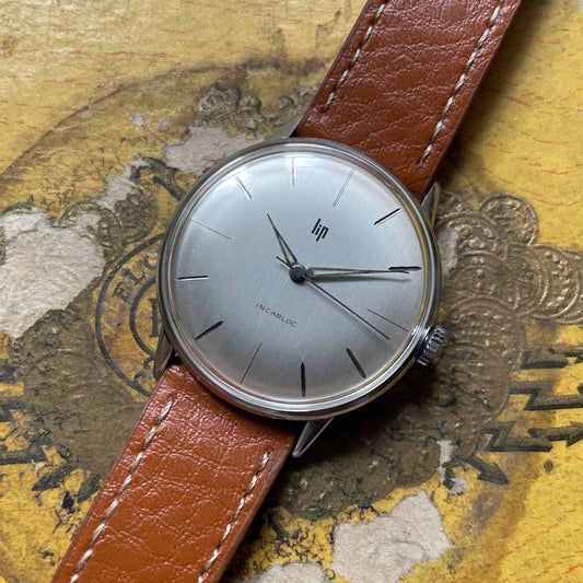 Reloj Vintage Lip Ultra -flat de la década de 1960 - Acero, Mecánica, Dial Grey