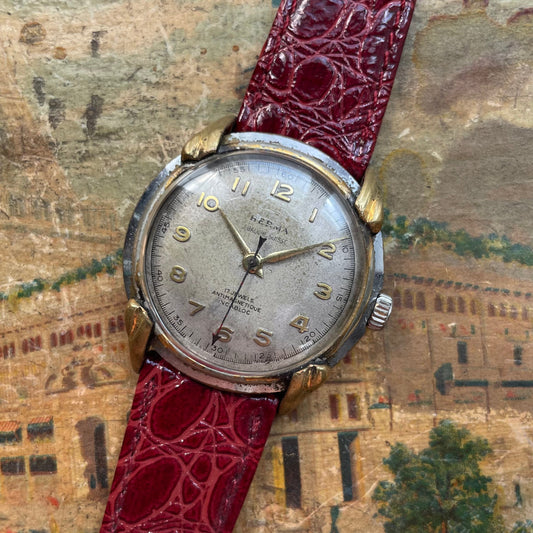 1950'lerden itibaren vintage Herma Watch, altın kaplı boynuzlu ve timsah deri bilezik ile çelik